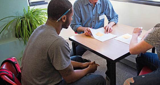 A student receiving support on a college paper at The Write Place.